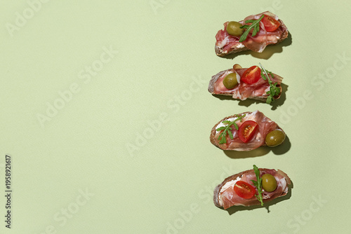 Tasty canapes with jamon, o...