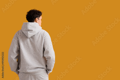Young man in grey sports su...