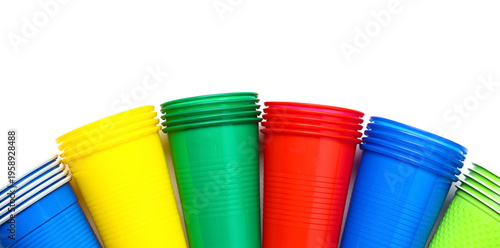 Colorful plastic cups on wh...