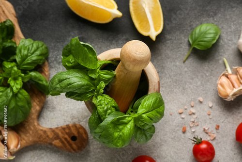 Wooden mortar with basil le...