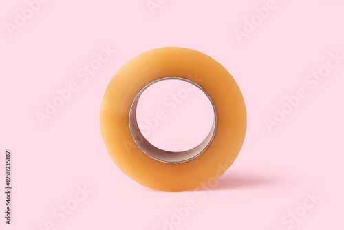 Adhesive tape roll on pink ...