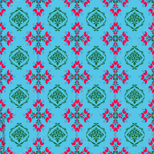 A vibrant seamless pattern in a classic Damask and floral vintage style. The design features ornate, green ornamental emblems interspersed with bright red floral motifs arranged in a symmetrical grid.