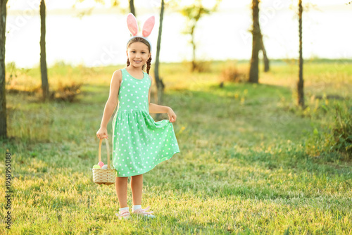 Little girl with bunny ears...