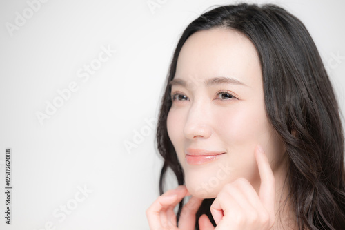 Moisturizing and hydrating the cheeks for a beautiful close-up—look up to the world of skincare, beauty salons, and aesthetics