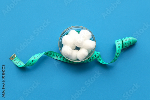 Bowl of cotton balls with m...