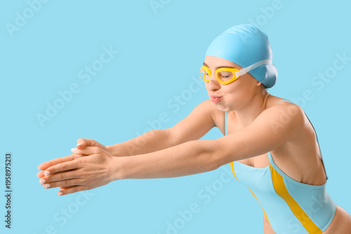 Young female swimmer swimmi...