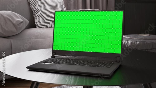 Laptop green screen mockup on coffee table in modern living room