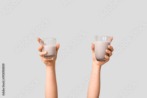 Female hands with glasses o...