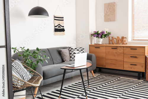 Black sofa with pillow and ...