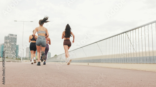 Women Running on Boardwalk for Fitness and Fun