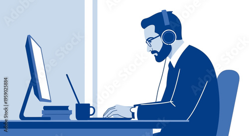 Man in headphones focused on computer work at desk