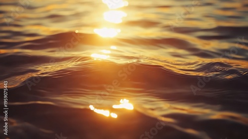 Golden hour sunset reflections shimmer across serene ocean waves during a peaceful coastal evening