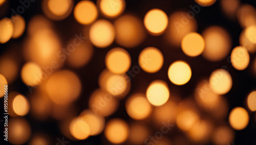 Dazzling golden yellow bokeh circles on black background creating a magical festive ambiance.