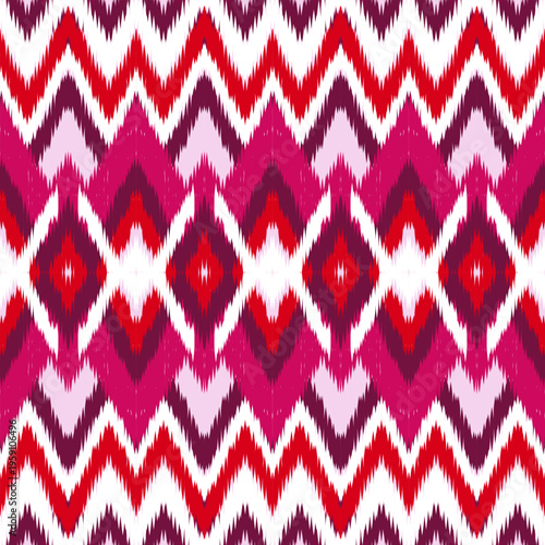Pink Ikat Zigzag Pattern Seamless Textile Not AI Generated.Bold pink ikat zigzag pattern inspired by traditional dyeing techniques.