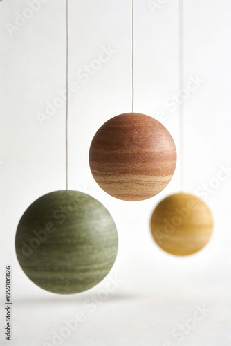 Three Minimalist Hanging Spheres Green Brown and Beige on White Background Modern Decor Illustration