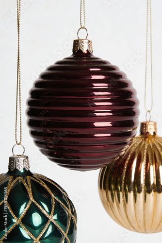Three Hanging Christmas Baubles Red Green and Gold with Patterns