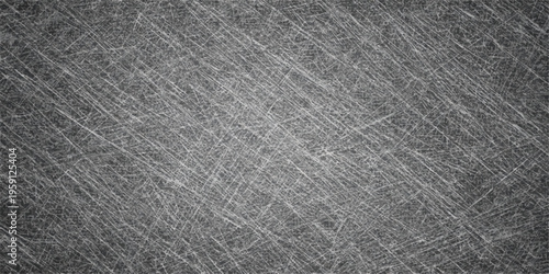 Abstract an etched metal surface showcases a textured design of intricate lines and subtle imperfections, suggesting an industrial or aged aesthetic.