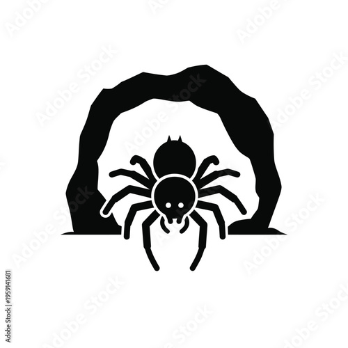 Black spider silhouette in front of cave entrance