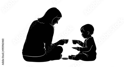 Mother and toddler silhouette having a tea party together
