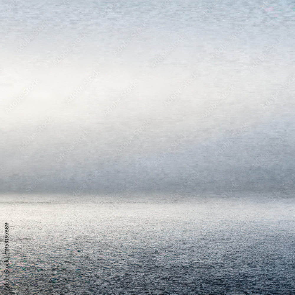 Fototapeta premium Calm water reflects gray sky near shoreline during early morning hours without any visible features in the distance