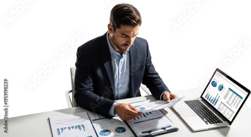 Businessman working on financial documents laptop.