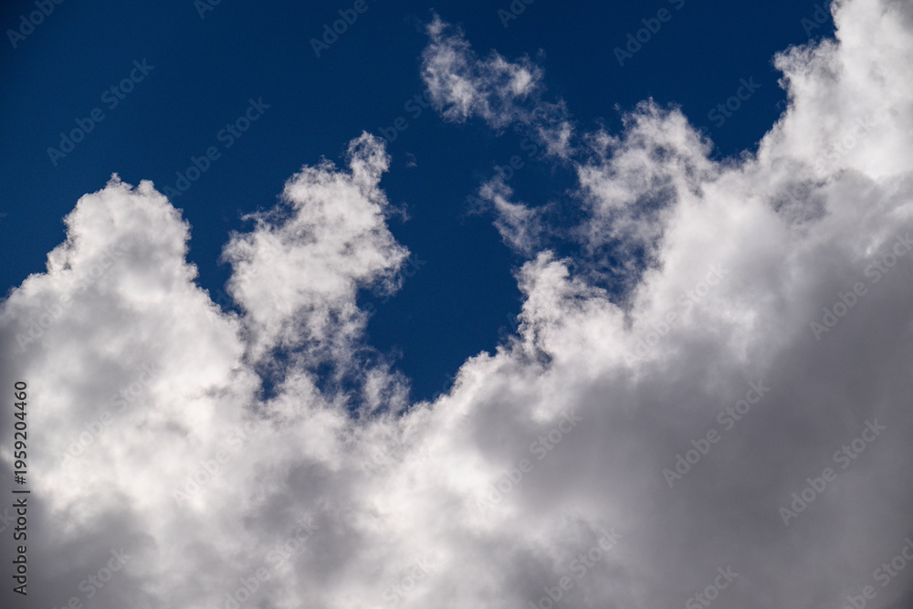 Obraz premium Clouds float in clear sky
