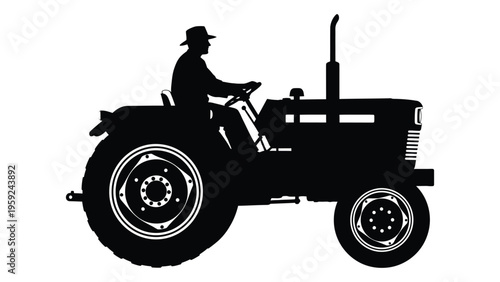 Silhouette of a man driving a vintage tractor