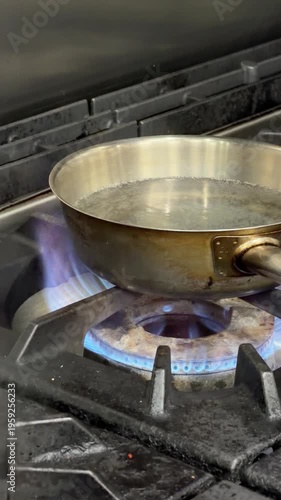 Water boiling in a saucepan on a gas stove