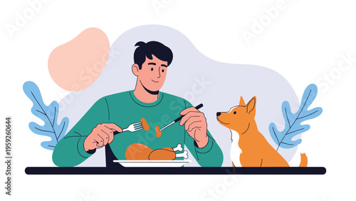 Young man sitting at a table and eating a roast chicken meal while a small dog looks on hopefully for a piece of the food.