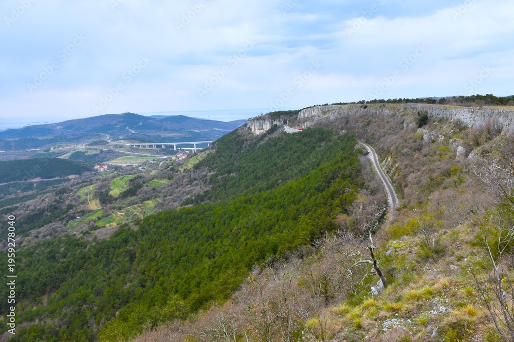 Obraz premium View of landscape at Bržanija with a railroad bellow the cliff and Črni Kal viaduct in Istria, Primorska, Slovenia