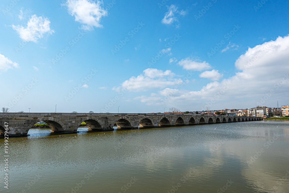 Fototapeta premium The scenic views of the historical stone Mimar Sinan Bridge in Silivri, Turkey, were built by the well-known architect Mimar Sinan in the 16th century.