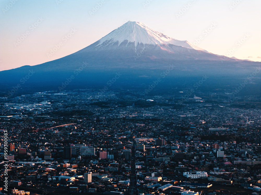 Fototapeta premium Mount Fuji and Fujiyoshida City with Warm Sunrise Light