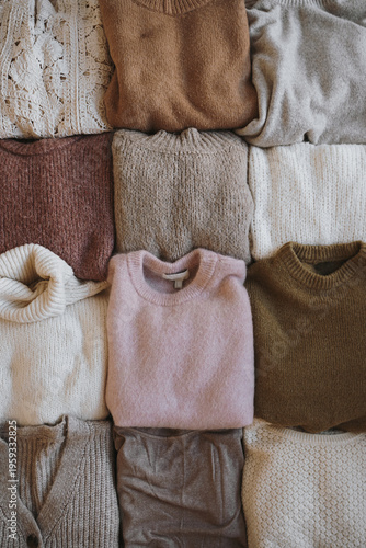 Cozy Winter Apparel Scene With Grid Of Varied Knitted Wool Jumpers and Cardigans