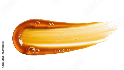 Beautiful golden-amber liquid cosmetic product swatch with glossy texture and small bubbles