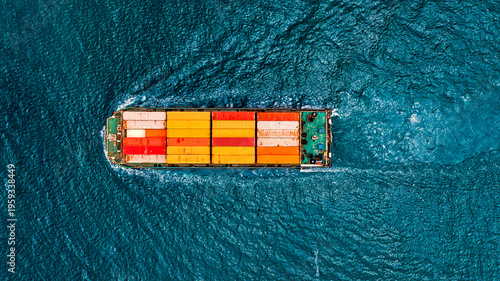 Aerial top view container ship full speed on the blue sea.
