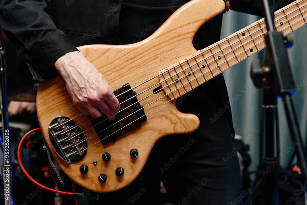 Fototapeta premium electric guitar in man hands, close-up view, young caucasian rock musician