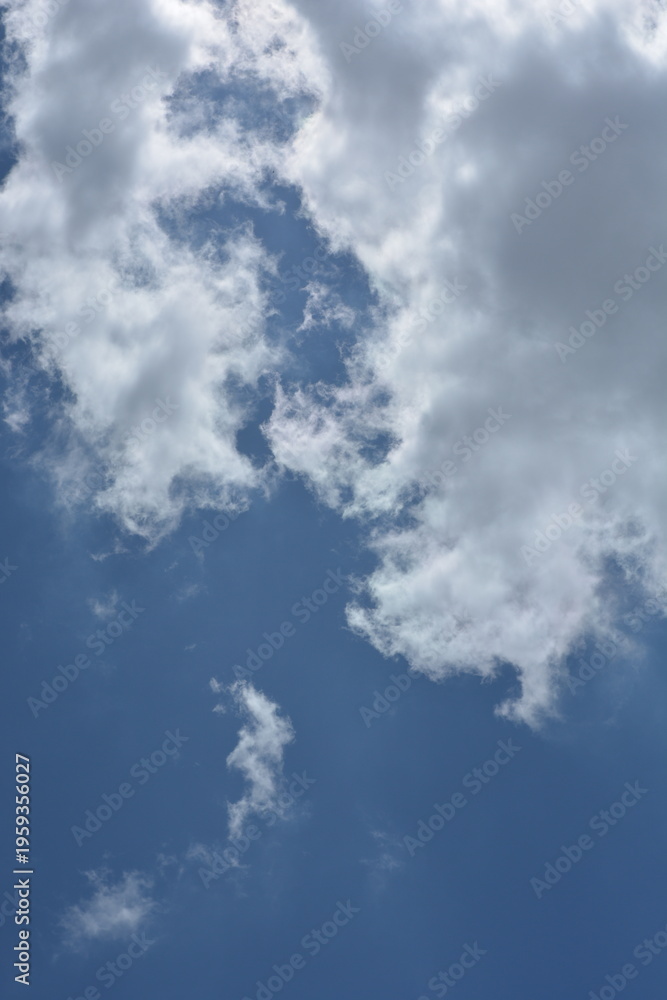 Obraz premium Dramatic Cloud Shapes In Bright Blue Sky