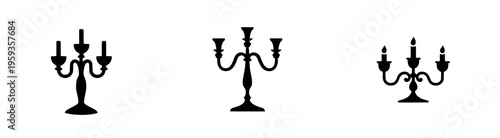 Elegant Elegance: An Ornate Three-Arm Metal Candelabra in Silhouette