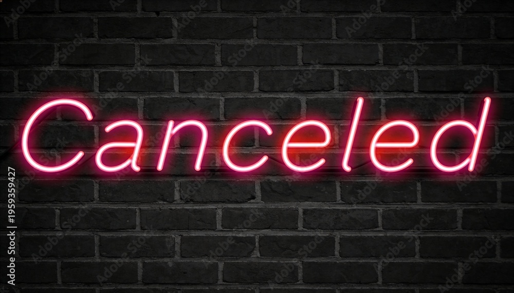 Fototapeta premium Glowing pink neon sign reading Canceled casting magenta halo on dark brick wall, with clips