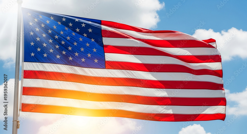 Obraz premium Waving American flag against a blue sky with clouds, symbolizes freedom, patriotism, and national pride, perfect for governmental or festive themes