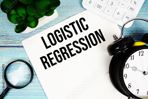 Bild auf Leinwand Logistic Regression written on paper placed on a blue wooden surface, alongside