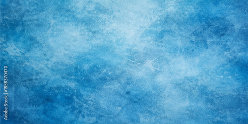 A bright abstract blue grunge background with a white winter frost texture featuring icy snowflake patterns and cold clouds under a clear sky