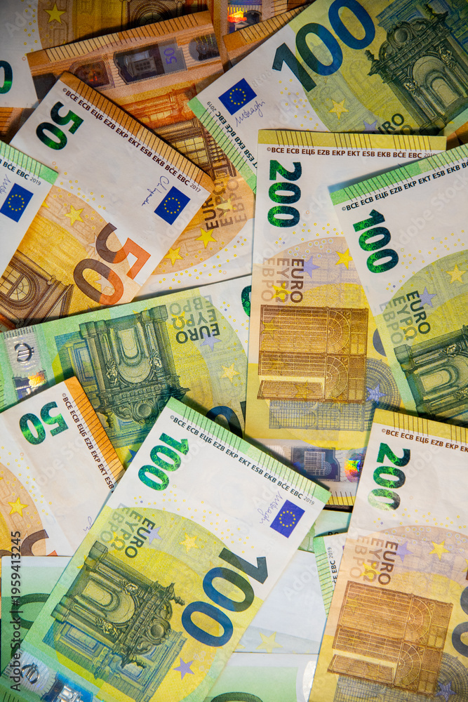 Obraz premium Euro bank notes. 50, 100, 200 euros. Pile of money.