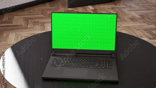 Slow push in to laptop green screen mockup on round table