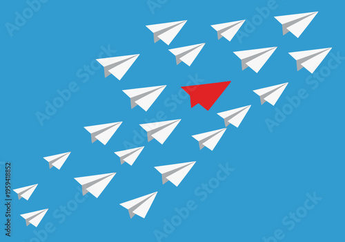 Red Paper Airplane Standing Out from a Group of White Planes; Leadership, Individuality, and Business Innovation Concept on Blue Background