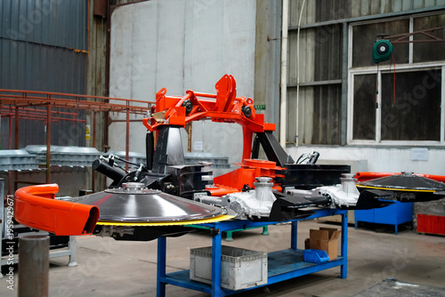 Scene of agricultural machinery components in factory workshop