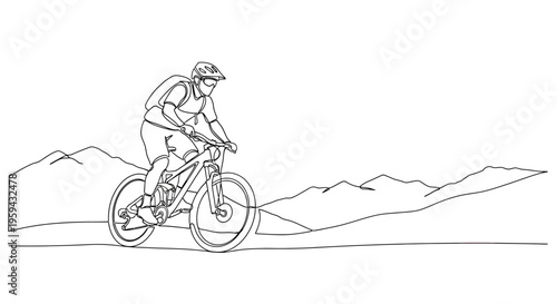 A solitary cyclist in protective gear navigates a mountainous landscape