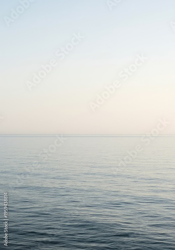 A vast, uninterrupted seascape where the calm ocean meets the pale, cloudless sky along a perfectly defined, empty horizon line, blank, water, ethereal
