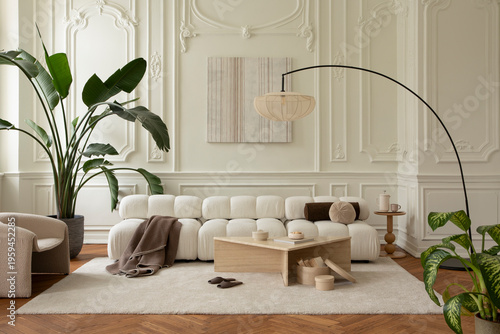 Minimalist living room with modern modular sofa, soft rug, plants, and elegant decor, creating a calm home interior