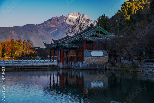 The beautiful scenery of ancient buildings in Yulong Snow Mountain and Heilongtan Park, Lijiang City, Yunnan Province, China were captured on January 12, 2026